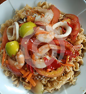 delicious asian food , dry noodle with seafood salad