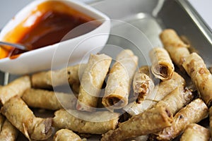 Delicious asian spring rolls in a pan