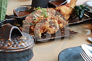 Delicious Asian Thai Dishes, Fried Soft Shell Crab with Salt and Pepper on Dark Ceramic Dinnerware