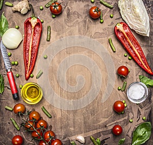 Delicious assortment of farm fresh vegetables cherry tomatoes, bell pepper, butter, cabbage, wooden salad spoon place text,fr