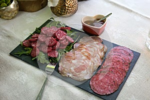 Delicious assortment of Portuguese cured meats, expertly sliced and ready to spice up your visual project. photo