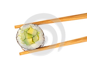 Delicious avocado sushi roll on background