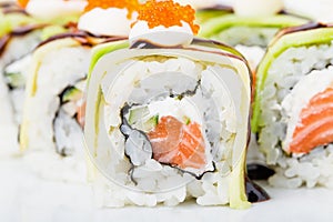 Delicious avocado sushi roll with salmon.