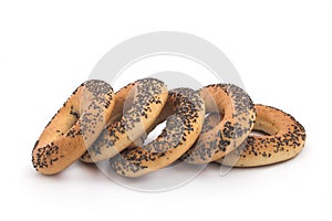 A delicious bagel with poppy seeds isolated on a white background