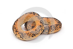 A delicious bagel with poppy seeds isolated on a white background