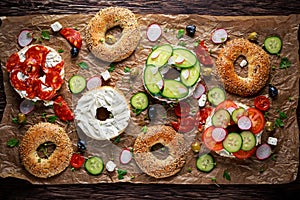 Delicious Bagel sandwiches with soft cheese, chorizo and vegetables