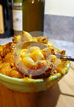Delicious baked mac and cheese made with shell macaroni  creamy cheddar cheese sauce  beer and breadcrumb topping. photo