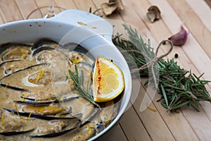 Delicious baked mussles with cream sauce. mushrooms and rosemary