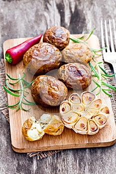 Delicious baked potato and garlic with chillie and rosemary