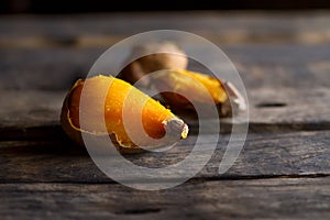 Delicious baked sweet potato on rural wooden.