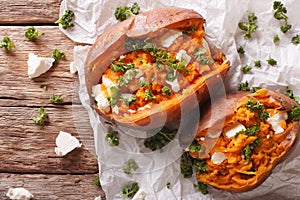 Delicious baked sweet potatoes stuffed with feta cheese and pars