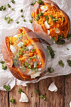 Delicious baked sweet potatoes stuffed with feta cheese and pars