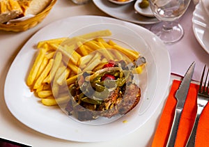 Delicious baked with vegetables pork with french fries