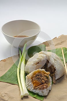 Delicious baozi, Chinese steamed pork bun on white background