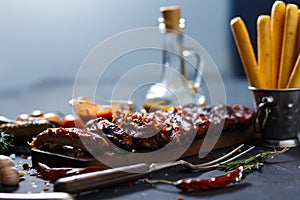 Delicious barbecued ribs seasoned with a spicy basting sauce and served with chopped