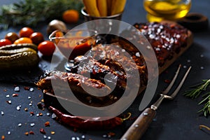 Delicious barbecued ribs seasoned with a spicy basting sauce and served with chopped