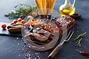 Delicious barbecued ribs seasoned with a spicy basting sauce and served with chopped