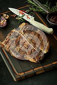 Delicious barbecued t-bone steak with herbs