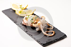 Delicious BBQ cuttle fish on a stone dish