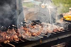 Delicious bbq kebab grilling on open grill, outdoor kitchen. foo