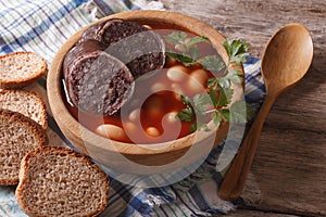 Delicious bean soup Fabada asturiana closeup horizontal