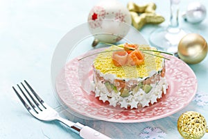 Delicious and beautiful layered salad with salted salmon, avocado, boiled egg and rice