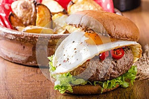 Delicious beef burger with egg