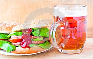 Delicious beef hamburger mug beer
