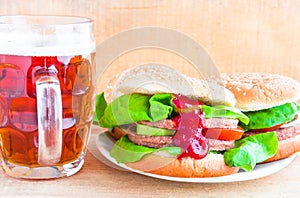 Delicious beef hamburger mug beer