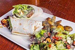 Delicious beef kabab with fresh salad and grilled garlic photo