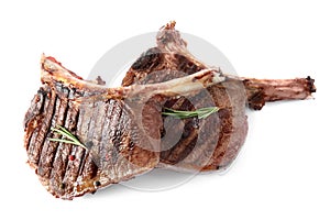 Delicious beef steaks with rosemary isolated on white, top view