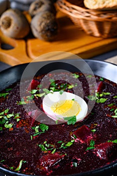 A Delicious beetroot borscht with egg