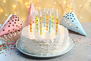 Delicious birthday cake with burning candles