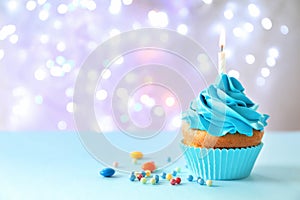 Delicious birthday cupcake with candl