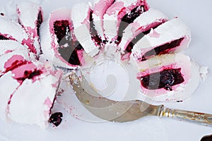 Delicious biscuit cake with pink raspberry jam