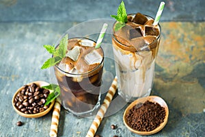 Delicious black and latte iced coffee in the glass