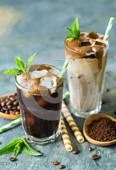 Delicious black and latte iced coffee in the glass