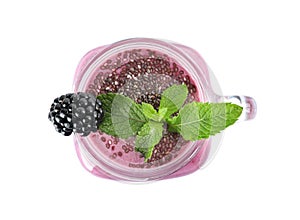 Delicious blackberry smoothie in mason jar on white background