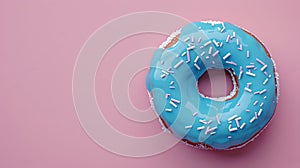 Delicious blue frosted doughnut with sprinkles on a soft pink backdrop. Ideal for food blogs and adverts. Simple and