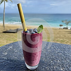 Delicious blueberry smoothie with bamboo straw.