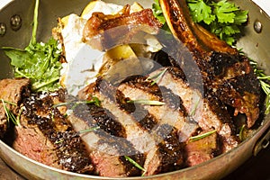 Delicious bone in rib eye steak served in steel pan
