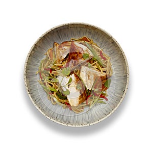 A delicious bowl of chicken chow mein, noodles and vegetables, in a rustic bowl isolated on white