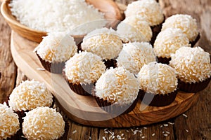 Delicious Brazilian sweets beijinhos de coco with condensed milk