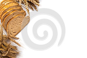 Delicious bread. Fresh loaf of rustic traditional bread with wheat grain ear or spike plant isolated on white background. Rye