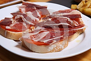 Delicious bread toast with natural tomato and ham