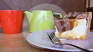 Delicious breakfast with coffee fresh croissants and slice of orange fruit on hotel's balcony