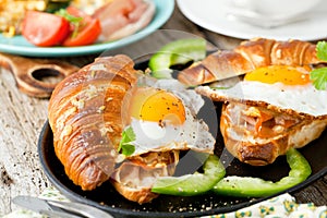 Delicious Breakfast with Croissant sandwiches with Fried Egg.