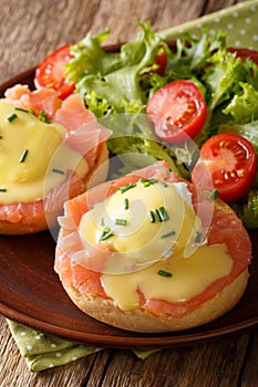 Delicious breakfast: eggs Benedict with salmon and hollandaise s