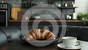 Delicious breakfast with fresh croissant and cup of hot drink in kitchen