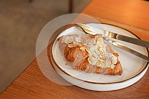 Delicious breakfast with fresh croissants and coffee served with butter